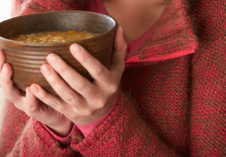 food-holding-bowl-of-soup-crop